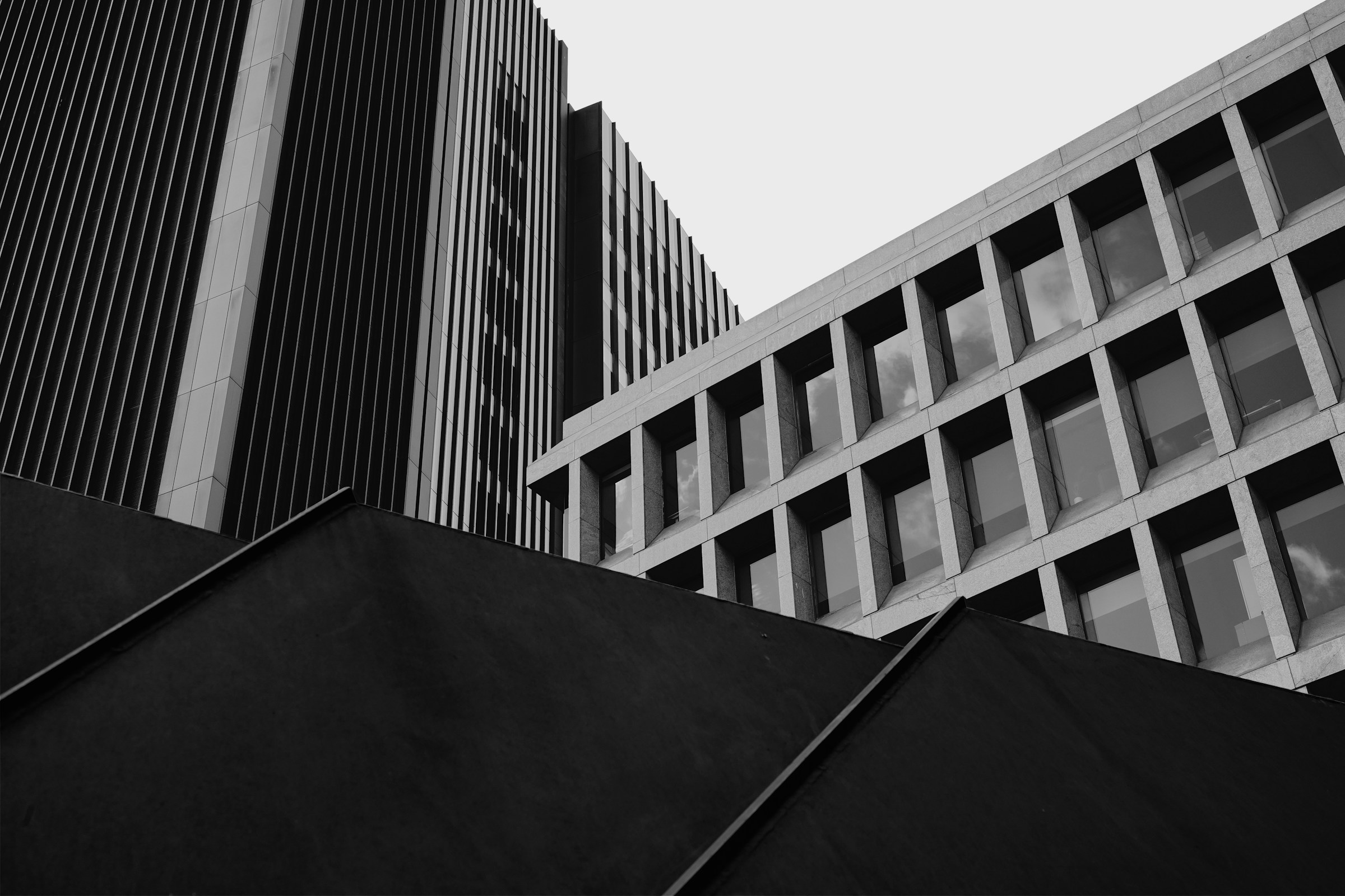 Geometric facades and intersecting structures of modern London buildings.