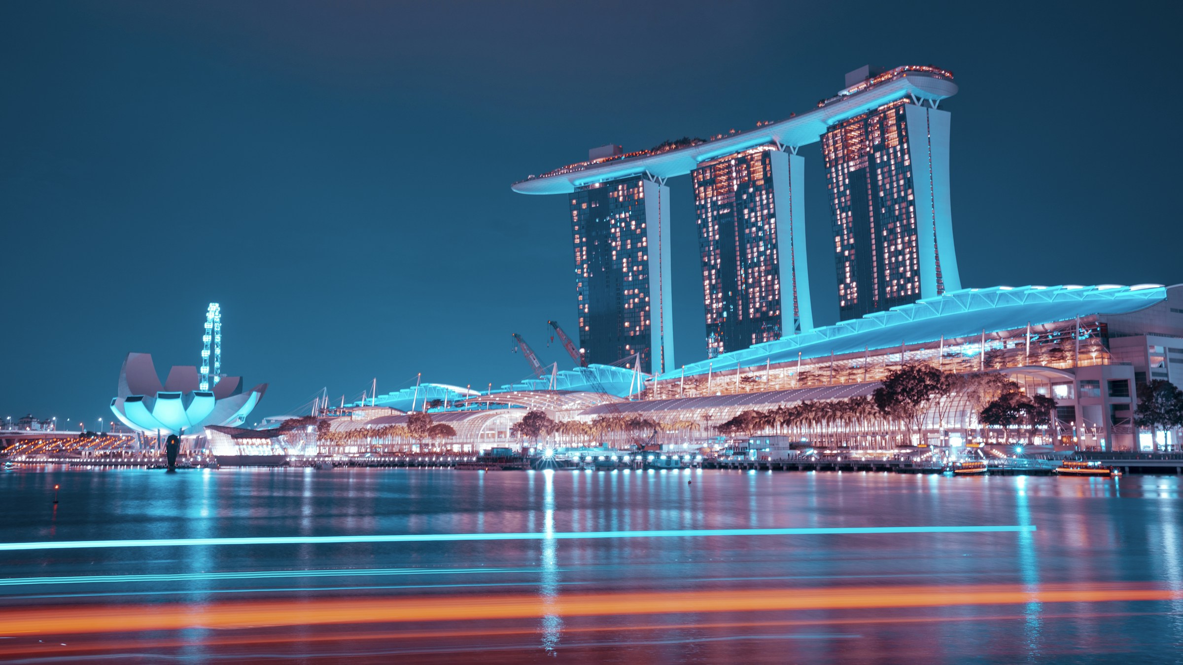 Singapore’s Marina Bay Sands illuminated beside the waterfront.